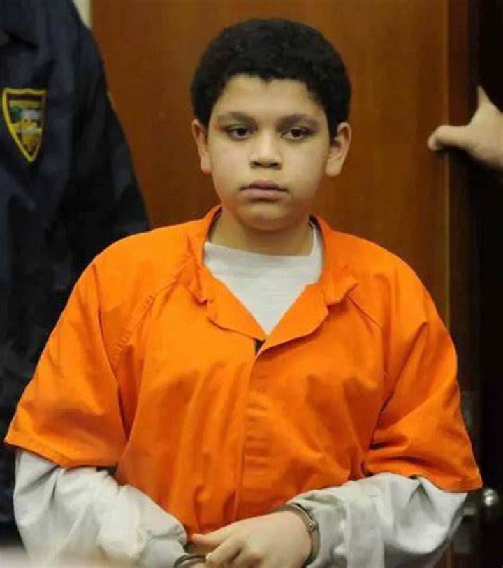 Advice: Cristian Fernandez, 13, left, talks with his attorneys in Jacksonville, Fla who question whether he fully understands his rights
