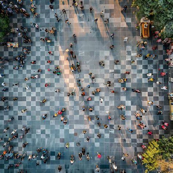 Aerial view of people taking part in a community paddle out for the victims of the Lahaina wildfires in Honolulu on August 19