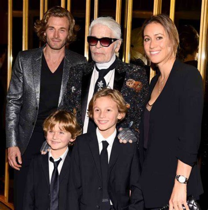 Brad Kroenig, right, was believed to be one of Lagerfeld's favourite models. Pictured on the Chanel catwalk in 2016 with his son Hudson