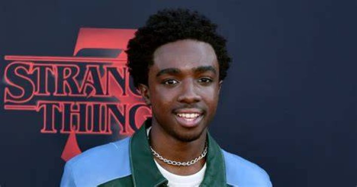 Casual: Stranger Things actor Caleb McLaughlin kept in casual in a long-sleeved top with a white top underneath and black trousers