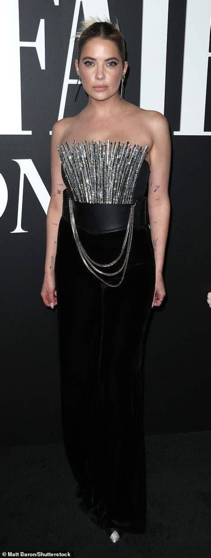 Daring: Ashley Benson turned heads in an edgy black jumpsuit with a bodice made of strips of metal that were covered in sparkly rhinestones
