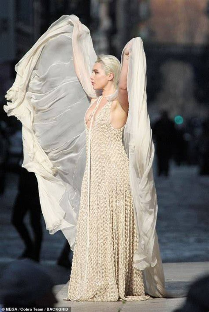 Florence could be seen waving the piece through the air as she posed for the camera during the shoot in the Italian capital