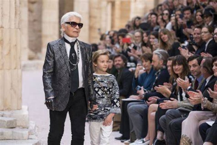 Hudson, right, was Lagerfeld's godson and appeared on the catwalk with his dad. Pictured: Hudson with his brother Jameson and Brad at the Daily Front Row's Fashion Media Awards in New York in 2018