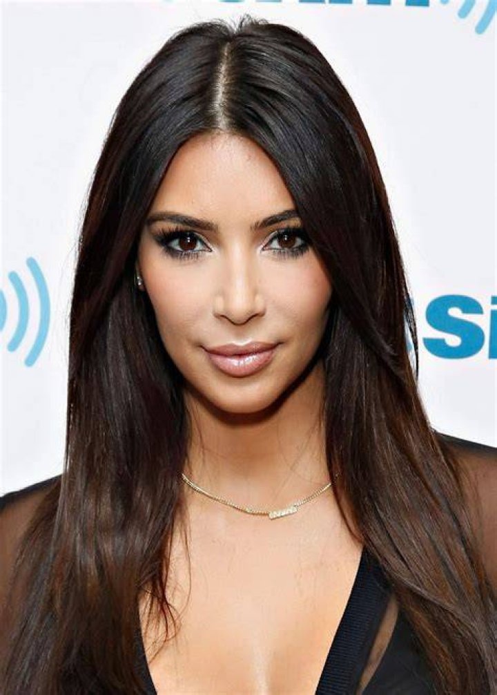 Kim's drenched locks flowed down her back in wet waves