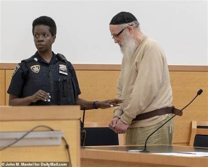 Kranczer was handcuffed on Monday, with the cuffs attached to a belt