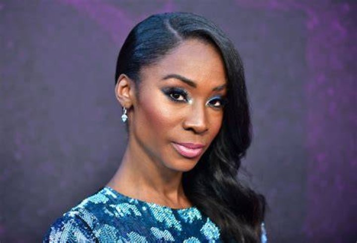 Looking good! Angelica Ross added a pop of colour to the event in a coral dress with a daring side split