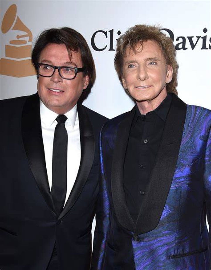 Manilow and his long-time business partner Garry Kief, 66, (pictured far left) married at their home in Palm Springs at a secret ceremony in April 2014