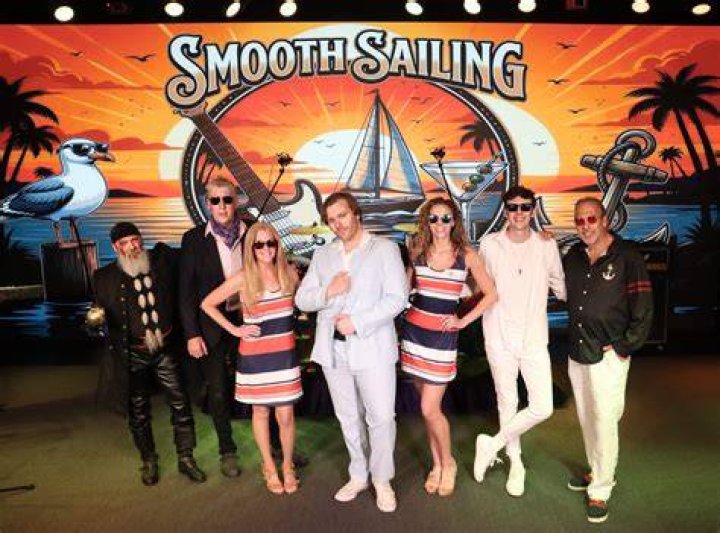 Smooth sailing: Christine watched on from the comfort of a catamaran