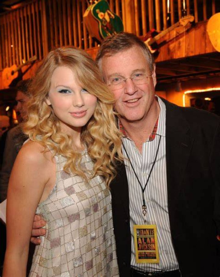 Taylor and her father Scott Swift (pictured with her mother Andrea in 2013) have long claimed that neither were aware of the plans to sell record label Big Machine Records - along with her music catalog - to Braun in 2019