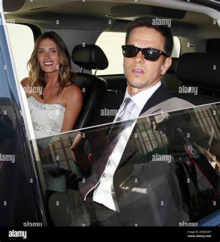 The happy couple: Wahlberg and Kunis held hands and look thrilled as they left the church together
