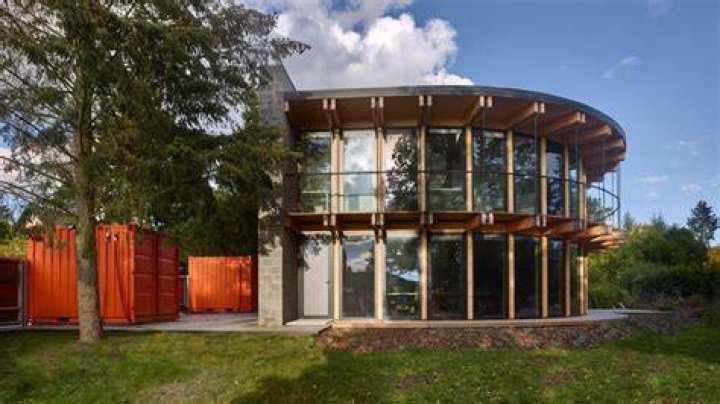 The house, which opens up to an extensive lower level and backyard on the ocean-facing side, is shown here with its previous roof