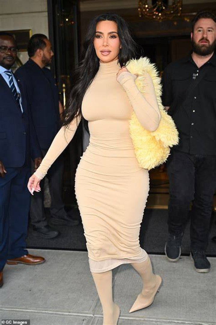 The older Kardashian flashed her famous, sand-covered backside after taking a dip