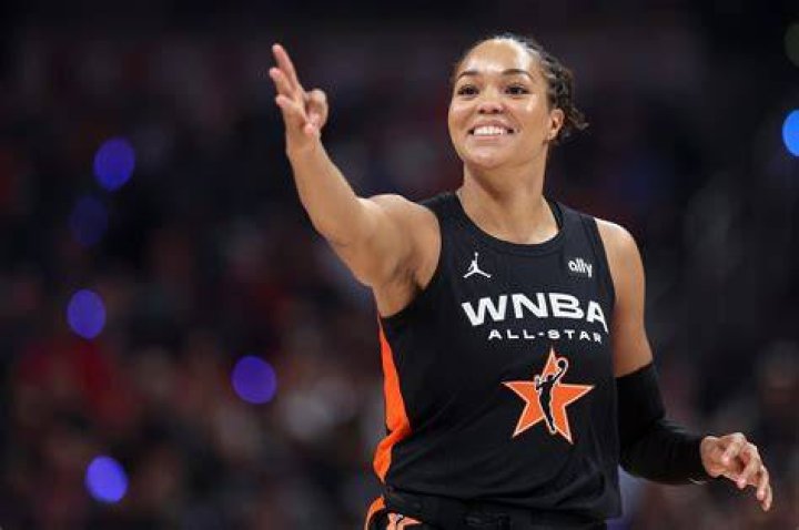 Winning look: WNBA star Glory Johnson models a wedding gown for her fiancee and fellow WNBA player Brittney Griner on Friday's Say Yes to the Dress: Atlanta