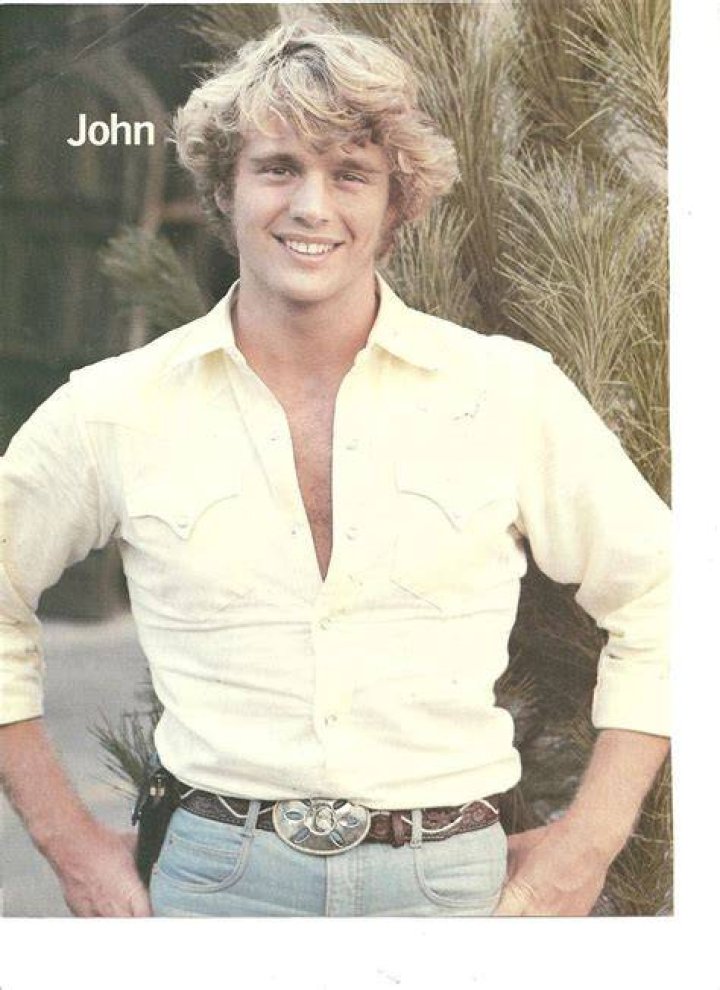 Yesteryear: John as Bo Duke in&nbsp;1970s and 1980s TV series Dukes Of Hazzard. He is pictured alongside costars Catherine Bach and Tom Wopat (left)
